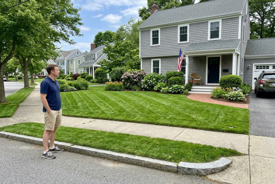 Homeowner considering professional lawn mowing for a residential property